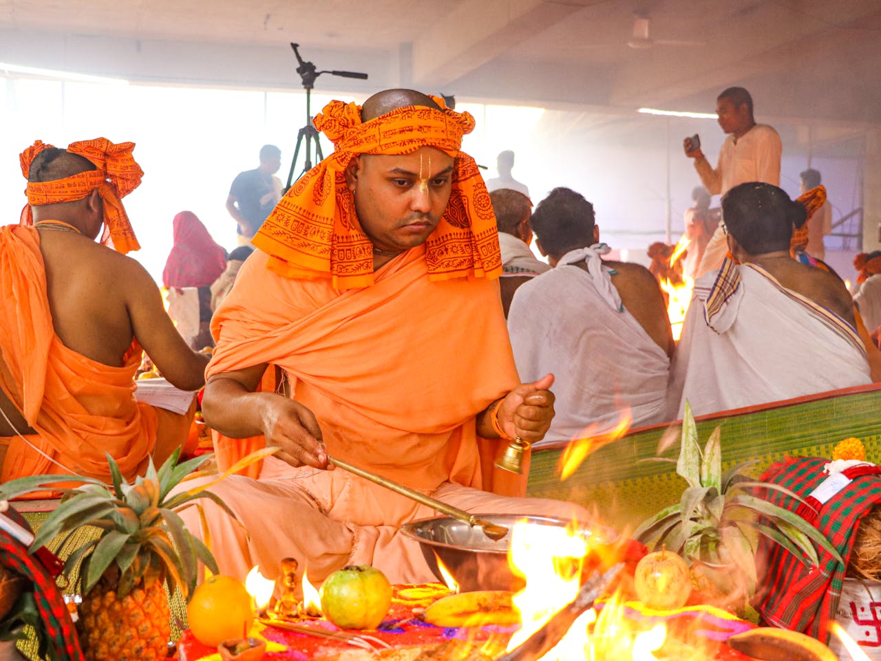 A vibrant Hindu ceremony with monks performing rituals in Dhaka, Bangladesh.