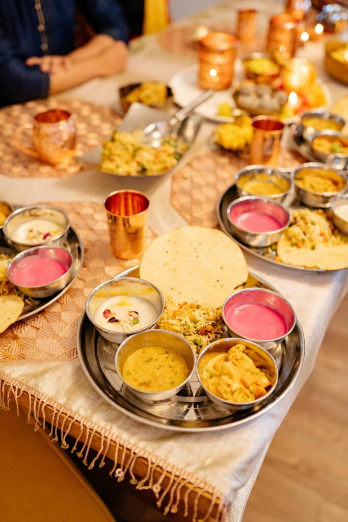 pexels-photo-8818732-8818732 A vibrant spread of traditional Indian dishes on a festive dinner table.